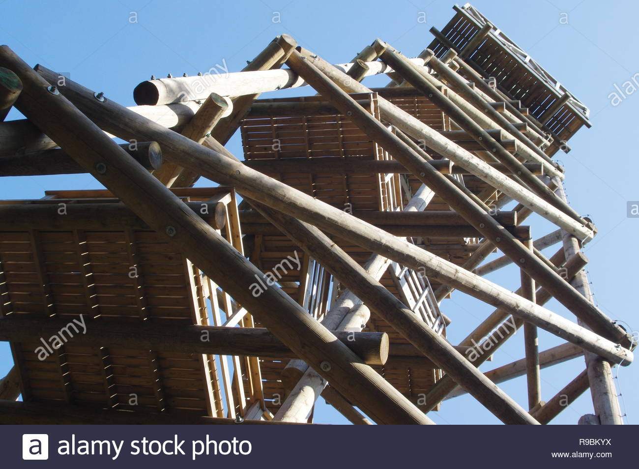 close up view on observation tower construction elements wooden tower in forest R9BKYX